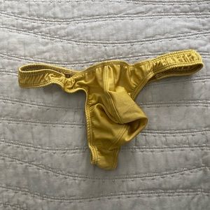 Brand new men’s thong in gold. Unlined. Size M